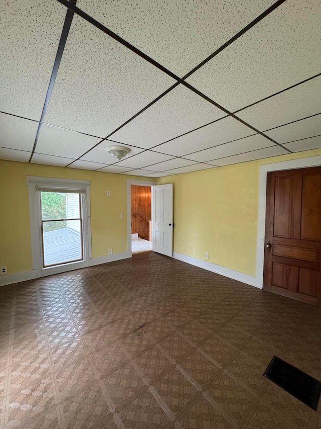 627 N Main St, Utica, OH 43080 - unfurnished room with a paneled ceiling, baseboards, and tile patterned floors