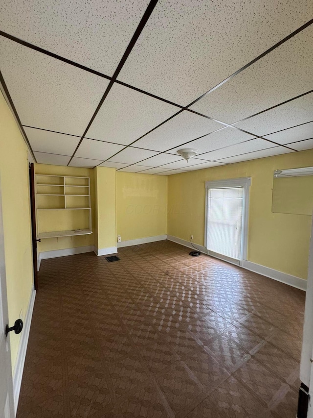 627 N Main St, Utica, OH 43080 - spare room with a paneled ceiling, built in features, and baseboards