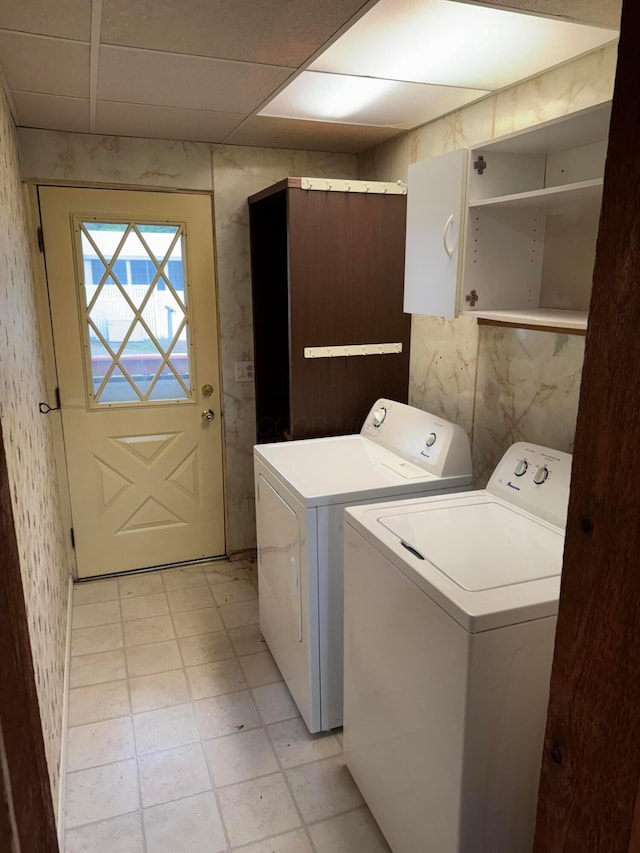 627 N Main St, Utica, OH 43080 - washroom featuring washer and dryer, cabinet space, and wallpapered walls