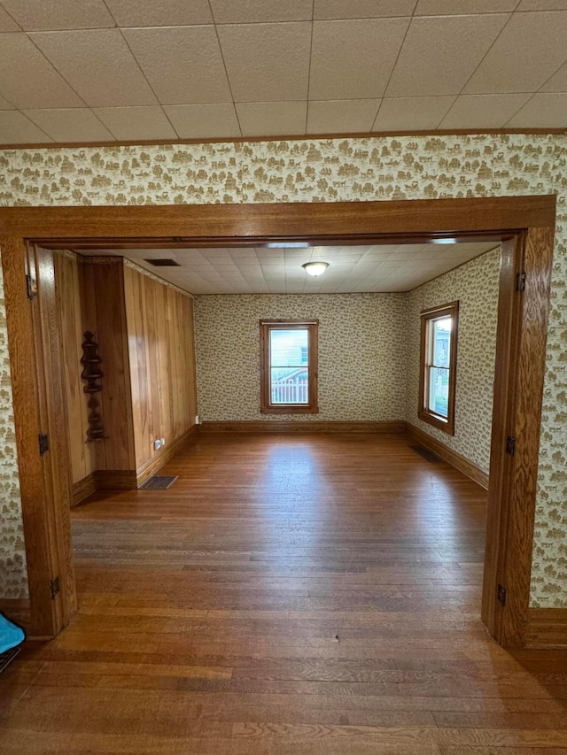 627 N Main St, Utica, OH 43080 - spare room featuring wood finished floors, baseboards, and wallpapered walls