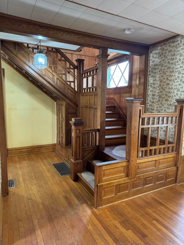 627 N Main St, Utica, OH 43080 - staircase featuring hardwood / wood-style floors and baseboards