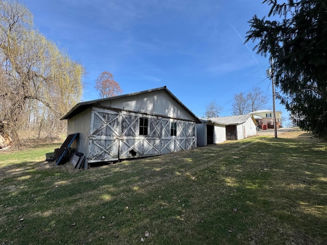 627 N Main St, Utica, OH 43080 - rear view of property featuring a yard, a barn, and an outdoor structure