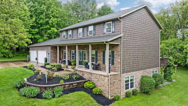 15027 King Rd, Howard, OH 43028 - colonial house featuring stone siding, a front yard, roof with shingles, and driveway