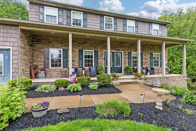 15027 King Rd, Howard, OH 43028 - view of front of property featuring covered porch and stone siding