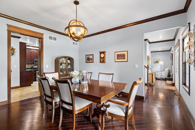 15027 King Rd, Howard, OH 43028 - dining space with ornamental molding, light wood finished floors, a chandelier, and baseboards