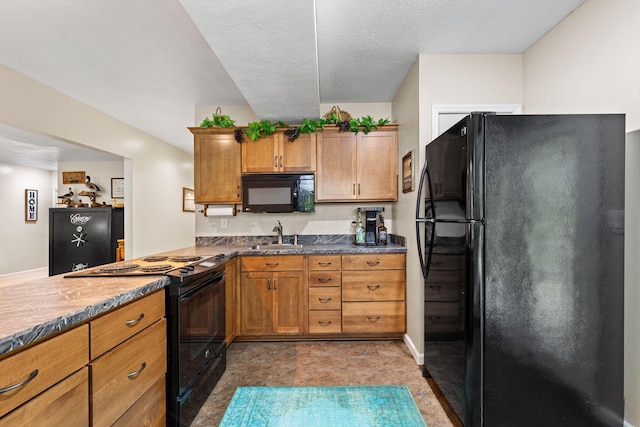 15027 King Rd, Howard, OH 43028 - kitchen with black appliances, a sink, brown cabinets, and dark countertops