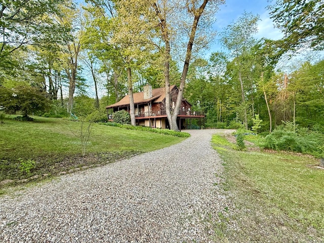 15626 Pleasant View Dr, Mount Vernon, OH 43050 - view of front facade with a chimney, driveway, and a front lawn