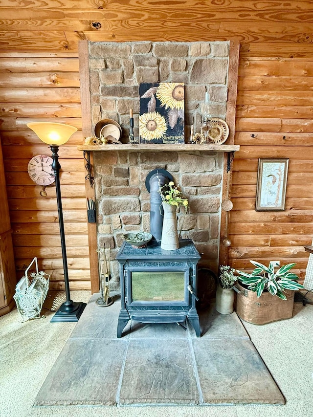 15626 Pleasant View Dr, Mount Vernon, OH 43050 - detailed view of a wood stove, log walls, and carpet flooring