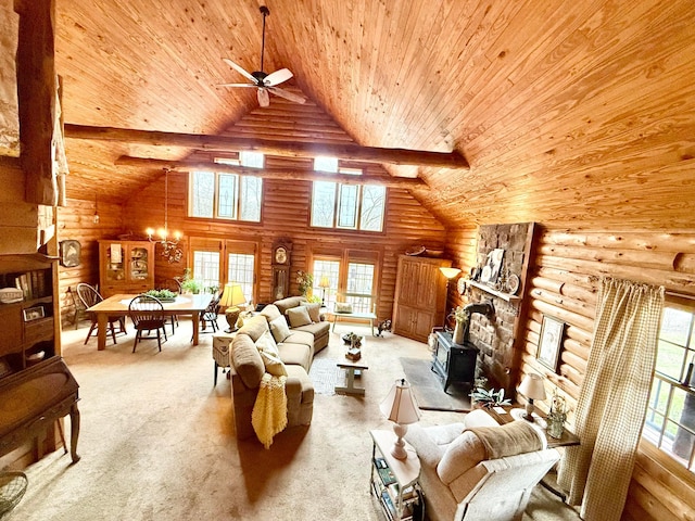 15626 Pleasant View Dr, Mount Vernon, OH 43050 - living area with log walls, wood ceiling, high vaulted ceiling, ceiling fan, and a wood stove