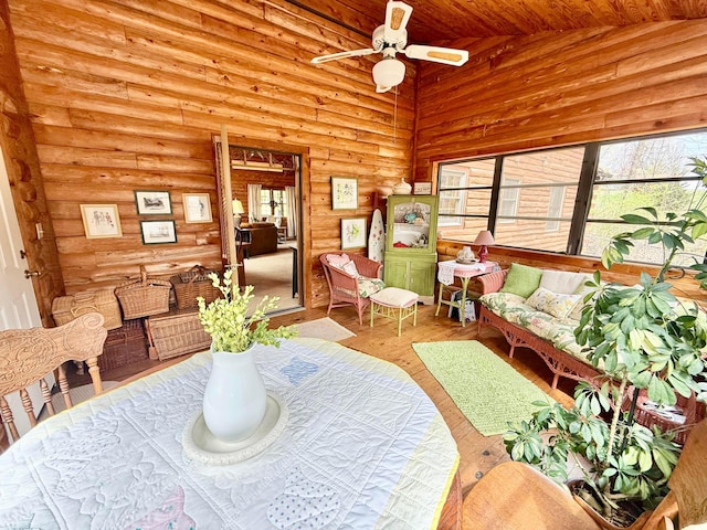 15626 Pleasant View Dr, Mount Vernon, OH 43050 - dining space featuring plenty of natural light, rustic walls, ceiling fan, wooden ceiling, and wood finished floors