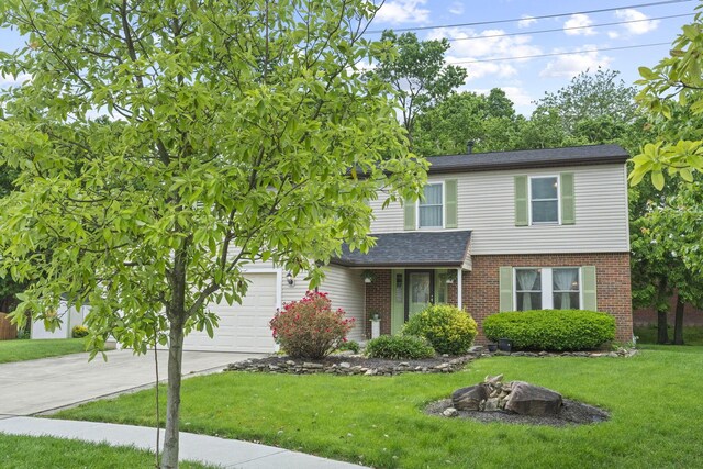 4129 Leitrim Ct, Dublin, OH 43016 - view of front of property with brick siding, a front yard, concrete driveway, and a shingled roof