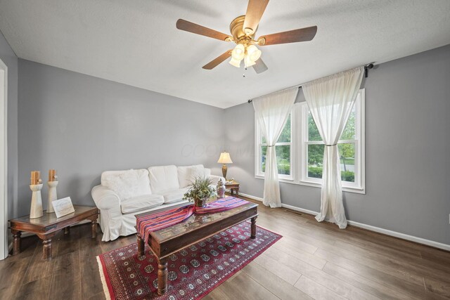 4129 Leitrim Ct, Dublin, OH 43016 - living room featuring ceiling fan, baseboards, and wood finished floors