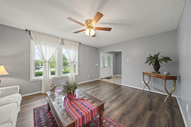 4129 Leitrim Ct, Dublin, OH 43016 - living room with a ceiling fan, wood finished floors, baseboards, and a textured ceiling