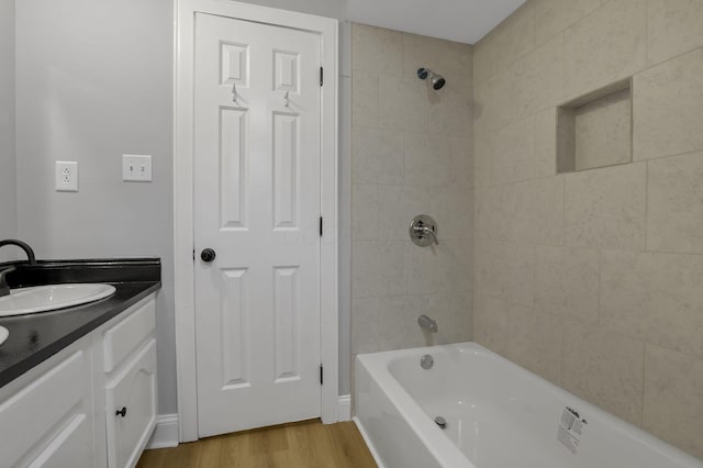 4230 Reed Rd, Columbus, OH 43220 - full bath featuring wood finished floors, vanity, and bathing tub / shower combination