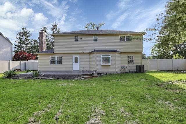 4230 Reed Rd, Columbus, OH 43220 - rear view of house with a chimney, a deck, and cooling unit