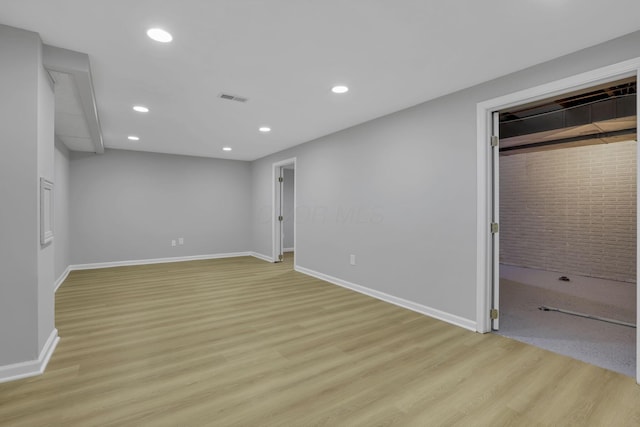 4230 Reed Rd, Columbus, OH 43220 - unfurnished bedroom with light wood-type flooring, a walk in closet, baseboards, and recessed lighting