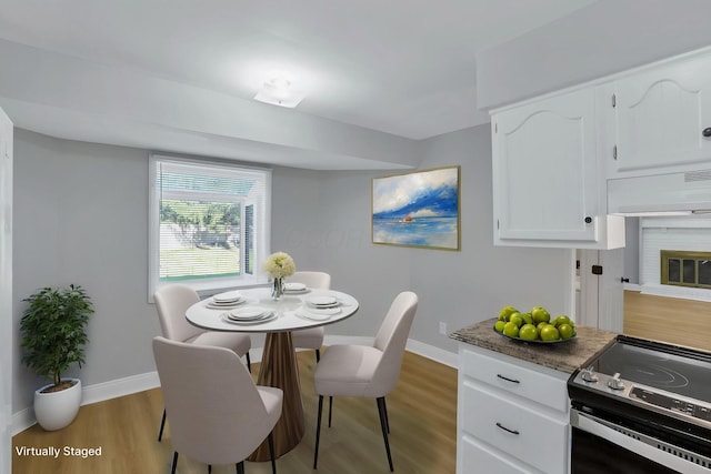 4230 Reed Rd, Columbus, OH 43220 - dining space with baseboards and wood finished floors
