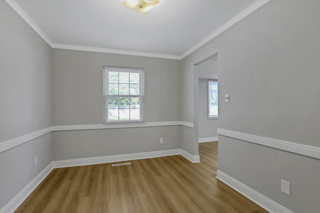 4230 Reed Rd, Columbus, OH 43220 - spare room featuring wood finished floors, baseboards, and crown molding