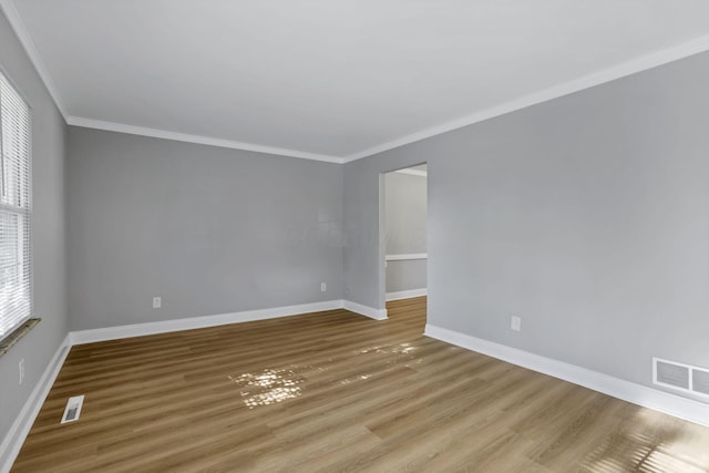 4230 Reed Rd, Columbus, OH 43220 - unfurnished room featuring ornamental molding, wood finished floors, and baseboards