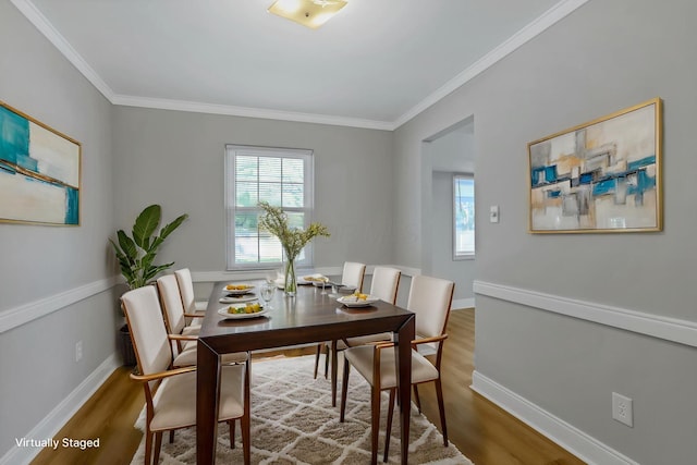 4230 Reed Rd, Columbus, OH 43220 - dining room with wood finished floors, crown molding, and baseboards