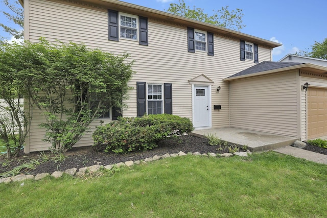 4230 Reed Rd, Columbus, OH 43220 - colonial inspired home featuring an attached garage and a front yard