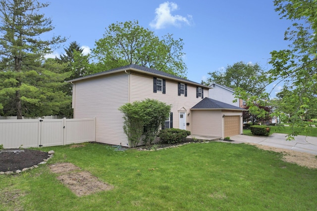 4230 Reed Rd, Columbus, OH 43220 - view of home's exterior with driveway, an attached garage, and a gate