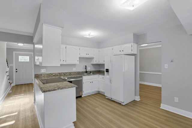 4230 Reed Rd, Columbus, OH 43220 - kitchen with white fridge with ice dispenser, dishwasher, a sink, black electric cooktop, and light wood-type flooring