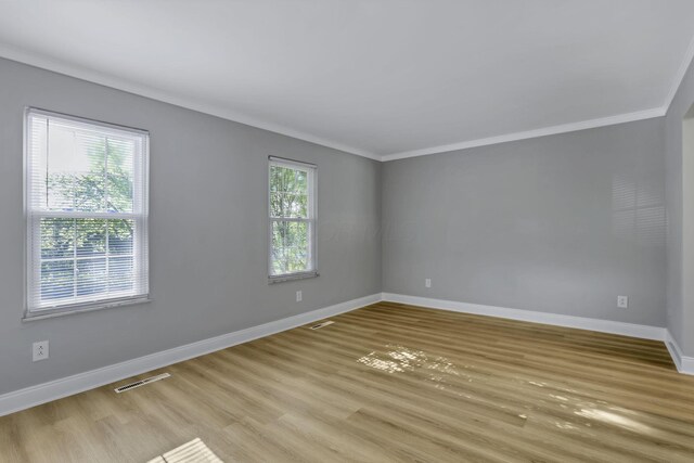 4230 Reed Rd, Columbus, OH 43220 - unfurnished room with light wood finished floors, baseboards, and crown molding