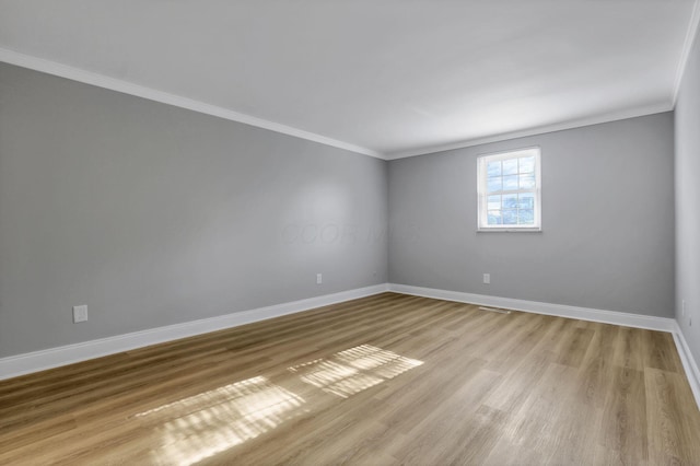 4230 Reed Rd, Columbus, OH 43220 - empty room with ornamental molding, baseboards, and light wood-style floors