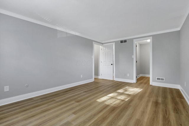 4230 Reed Rd, Columbus, OH 43220 - unfurnished room with crown molding, baseboards, and wood finished floors