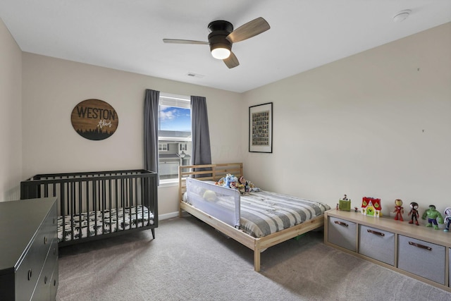 233 Dowler Dr, South Bloomfield, OH 43103 - bedroom featuring carpet flooring, ceiling fan, and baseboards