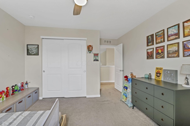 233 Dowler Dr, South Bloomfield, OH 43103 - bedroom with light colored carpet, a closet, a ceiling fan, and baseboards