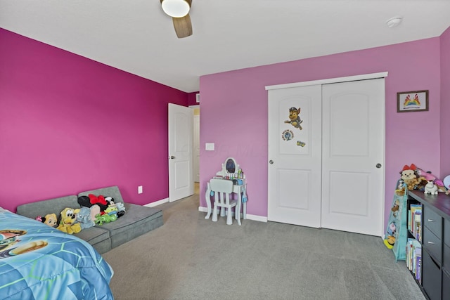 233 Dowler Dr, South Bloomfield, OH 43103 - carpeted bedroom featuring a ceiling fan, a closet, and baseboards