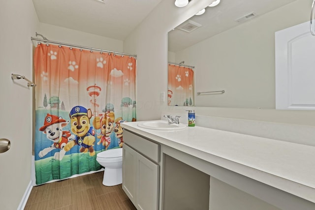 233 Dowler Dr, South Bloomfield, OH 43103 - bathroom featuring toilet, vanity, a shower with curtain, and baseboards