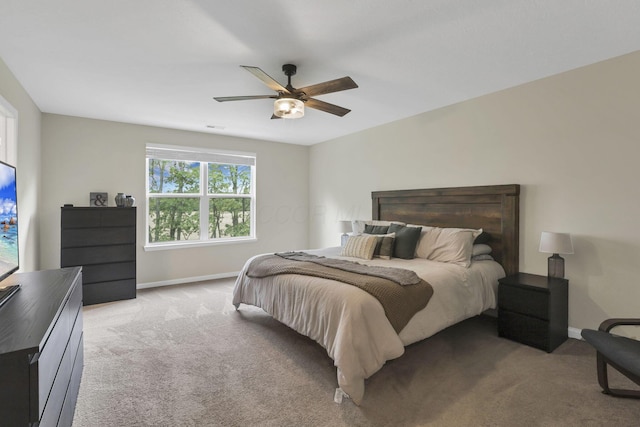 233 Dowler Dr, South Bloomfield, OH 43103 - bedroom featuring light colored carpet, baseboards, and ceiling fan