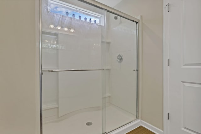 233 Dowler Dr, South Bloomfield, OH 43103 - bathroom featuring a stall shower and baseboards