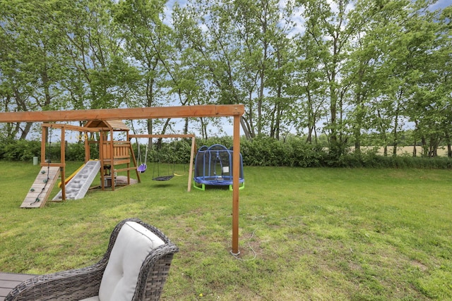 233 Dowler Dr, South Bloomfield, OH 43103 - view of green lawn with a trampoline and a playground