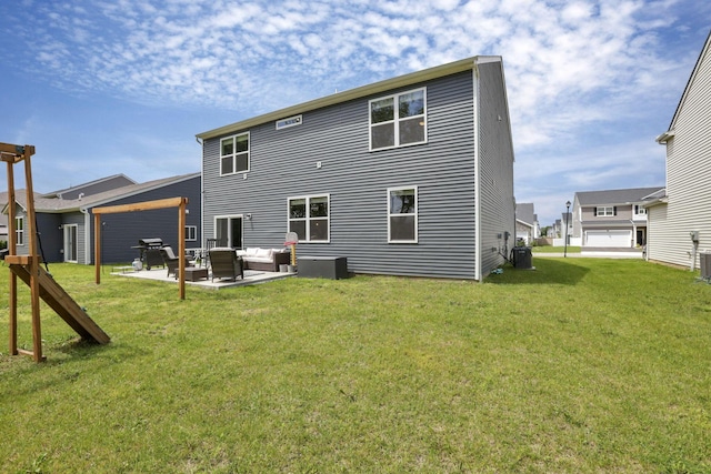 233 Dowler Dr, South Bloomfield, OH 43103 - back of house with an outdoor living space, a lawn, a patio area, and central AC
