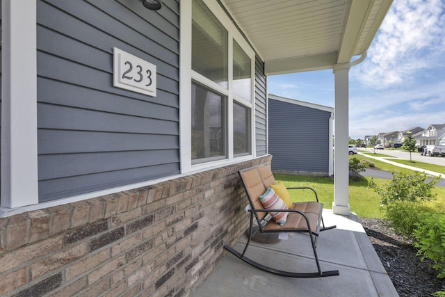 233 Dowler Dr, South Bloomfield, OH 43103 - covered porch with a residential view