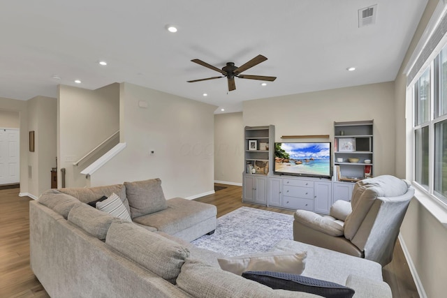 233 Dowler Dr, South Bloomfield, OH 43103 - living room with baseboards, ceiling fan, wood finished floors, recessed lighting, and stairs