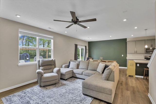 233 Dowler Dr, South Bloomfield, OH 43103 - living room featuring ceiling fan, wood finished floors, baseboards, and recessed lighting