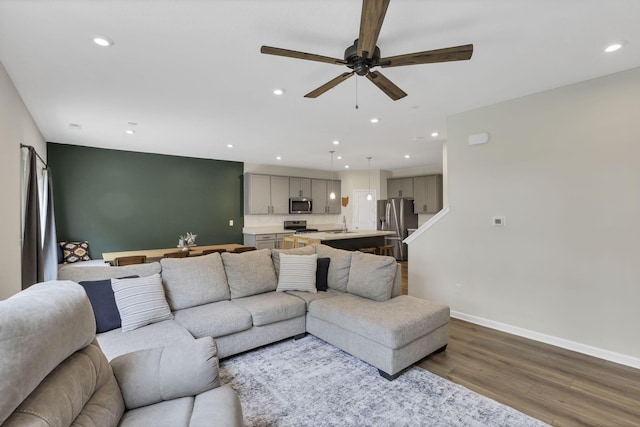 233 Dowler Dr, South Bloomfield, OH 43103 - living area with wood finished floors, recessed lighting, baseboards, and ceiling fan