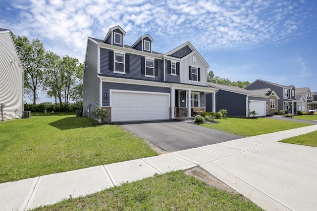 233 Dowler Dr, South Bloomfield, OH 43103 - traditional home featuring driveway, a front yard, a garage, and cooling unit