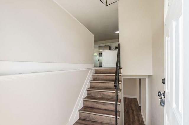 4795 Hafey Ave, Columbus, OH 43228 - staircase featuring baseboards and wood finished floors
