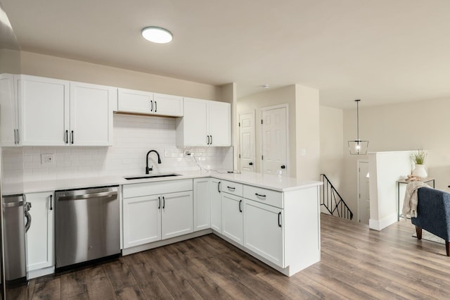 4795 Hafey Ave, Columbus, OH 43228 - kitchen featuring dishwasher, a sink, a peninsula, white cabinetry, and tasteful backsplash