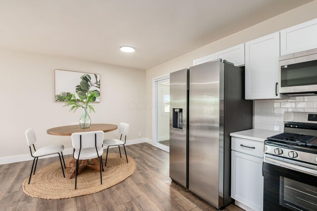 4795 Hafey Ave, Columbus, OH 43228 - kitchen featuring stainless steel appliances, light countertops, white cabinets, and baseboards
