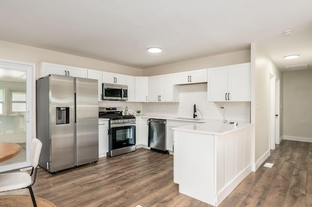 4795 Hafey Ave, Columbus, OH 43228 - kitchen featuring stainless steel appliances, a sink, light countertops, and dark wood finished floors