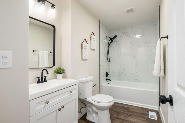 4795 Hafey Ave, Columbus, OH 43228 - full bathroom with vanity, toilet, wood finished floors, and bathtub / shower combination