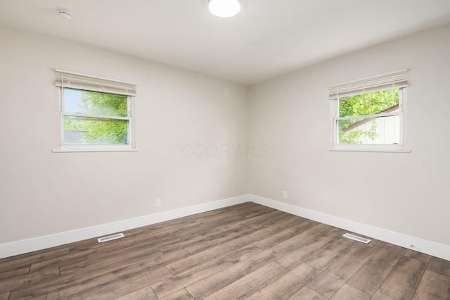 4795 Hafey Ave, Columbus, OH 43228 - unfurnished room featuring plenty of natural light, baseboards, and wood finished floors