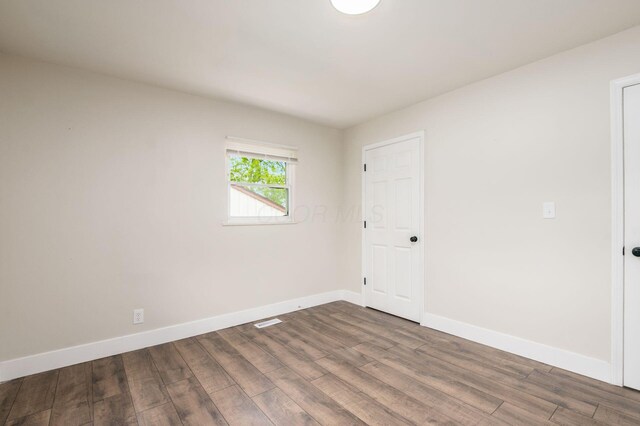 4795 Hafey Ave, Columbus, OH 43228 - spare room with wood finished floors and baseboards